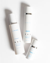 3-Step Glow Trio products arranged on white surface with soft shadows in gallery position 1